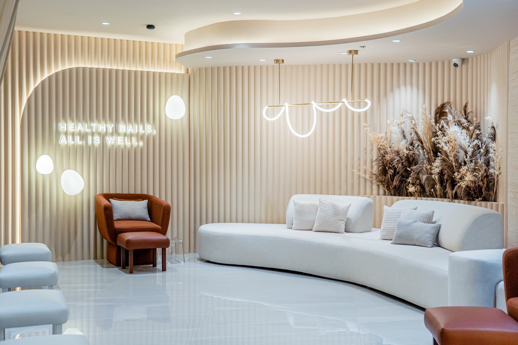 Cream lounge seating inside a noon talk nail salon